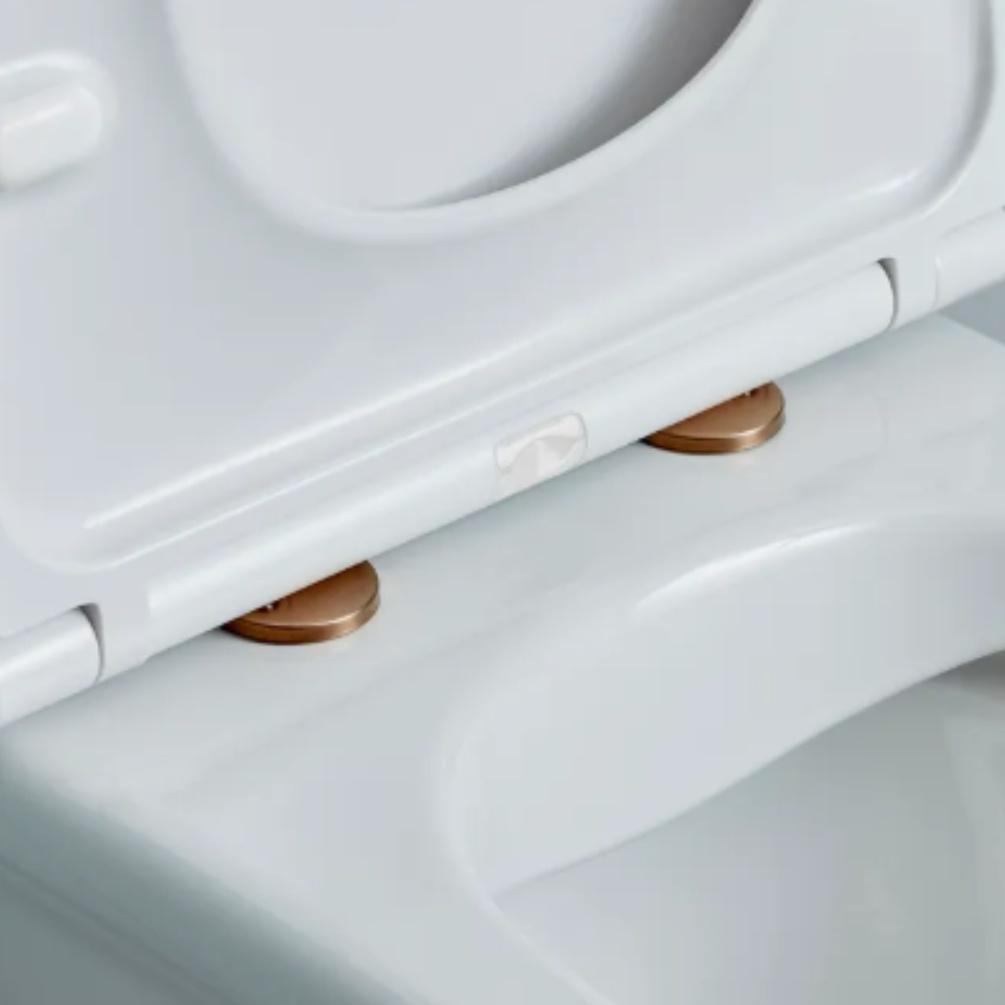 Lifestyle image of the Tavistock Brushed Bronze Wrap Over Toilet Seat Hinge Cover Caps